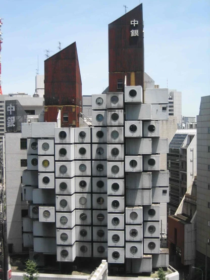 a large group of concrete buildings stacked high up in a city