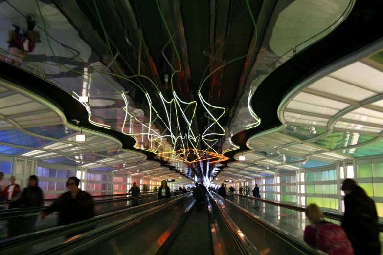 a group of people in an airport pulling carts