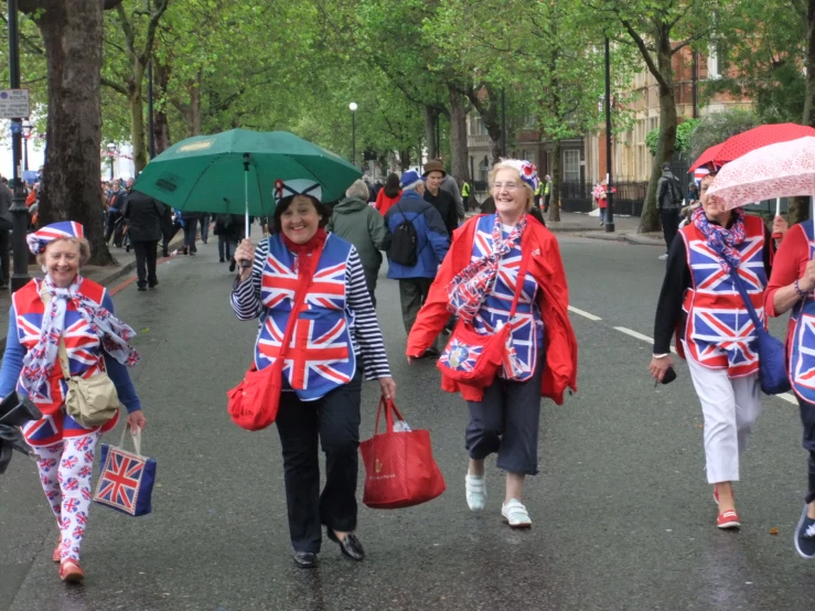 the people are walking down the street together