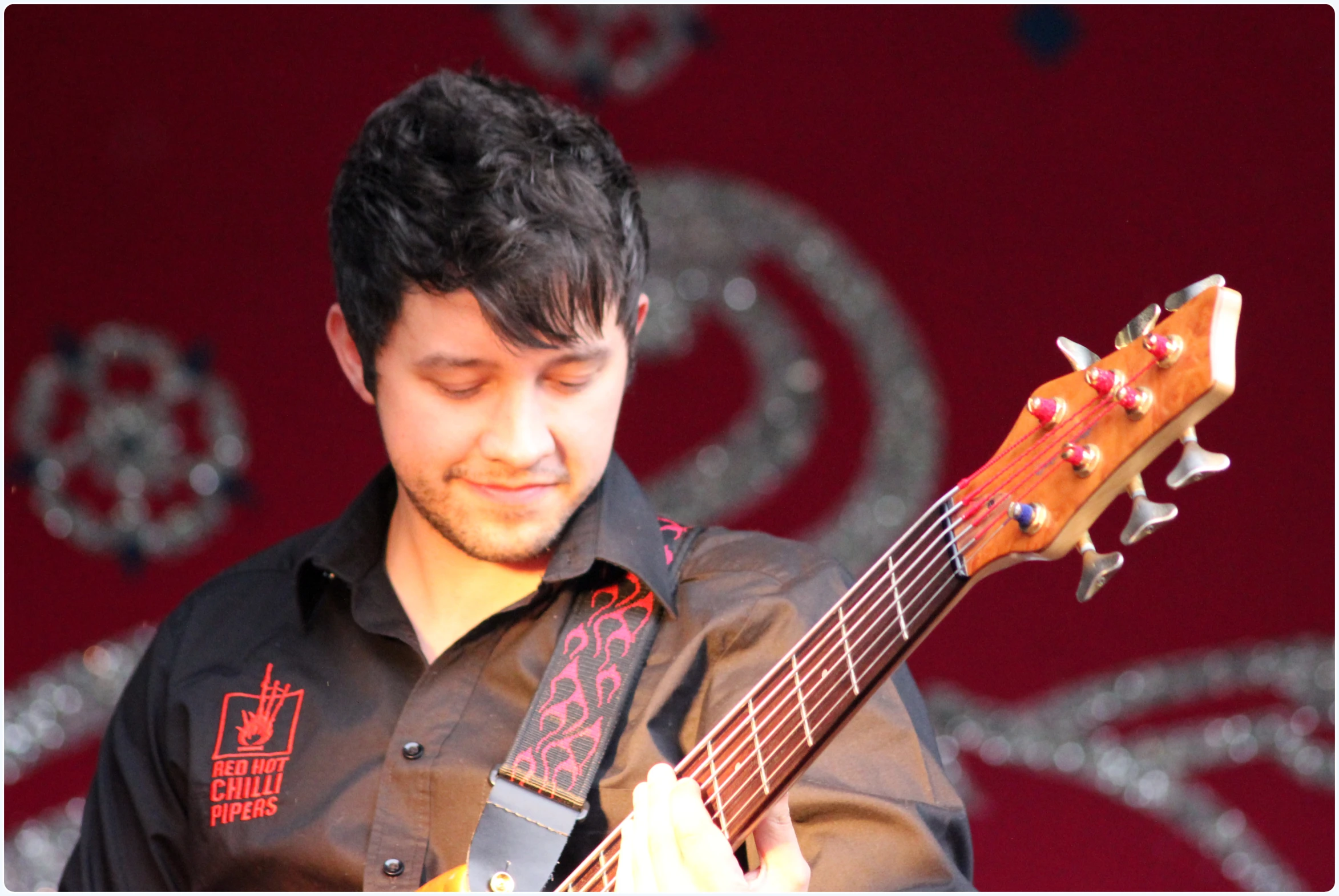 a man plays his ukulele in a music show