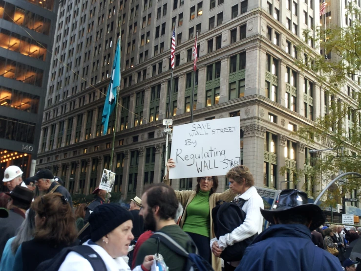 some people protesting in front of an office building