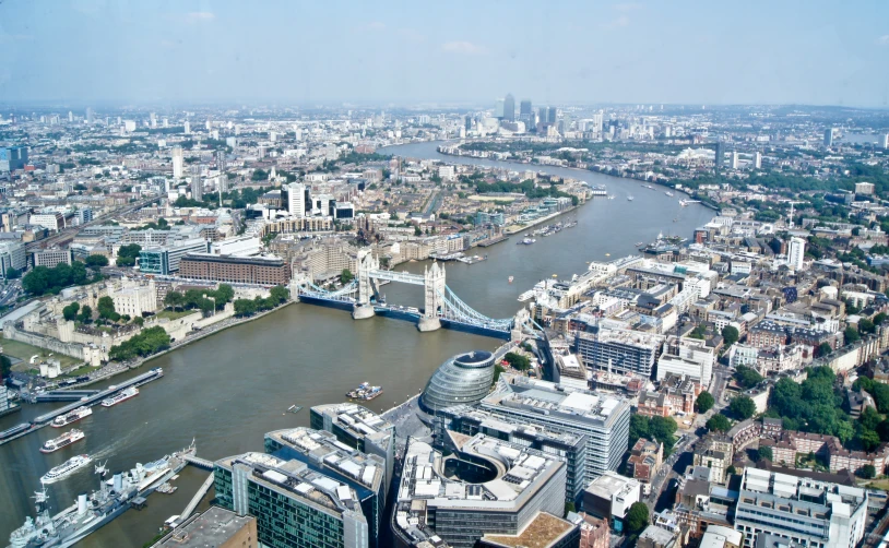 an aerial view of the city and river thames