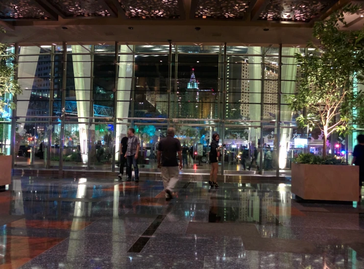 a group of people that are standing around a building