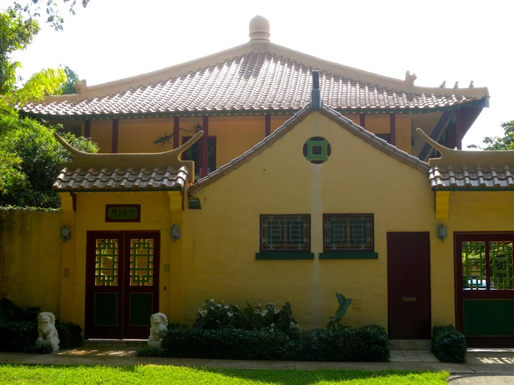 the building has a red roof with a large window