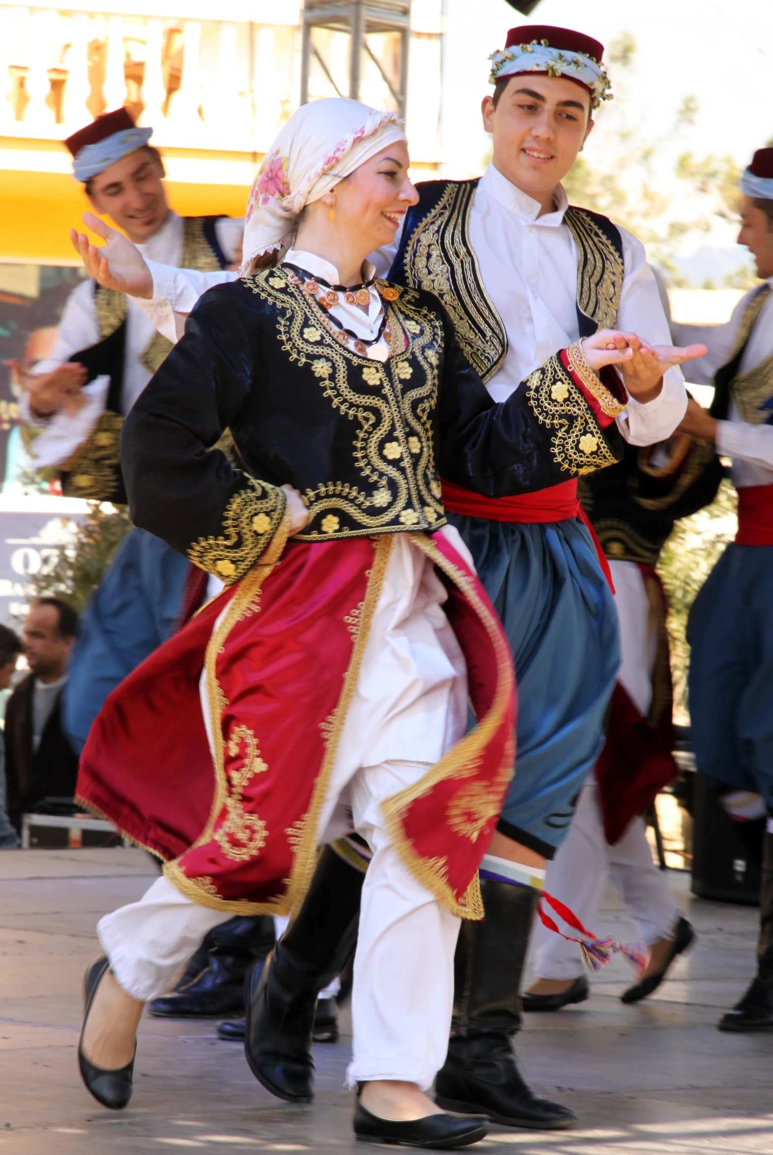 a couple dressed in traditional dress in the streets