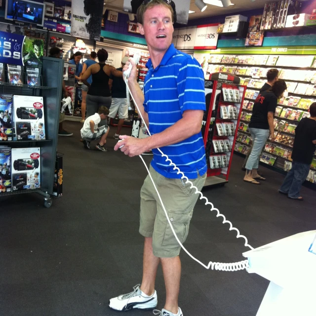 a man holding a cord phone in his hands