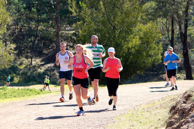 a group of people that are running in the dirt