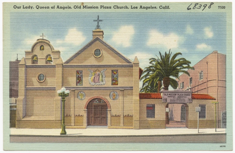 a large building with palm trees and a palm tree