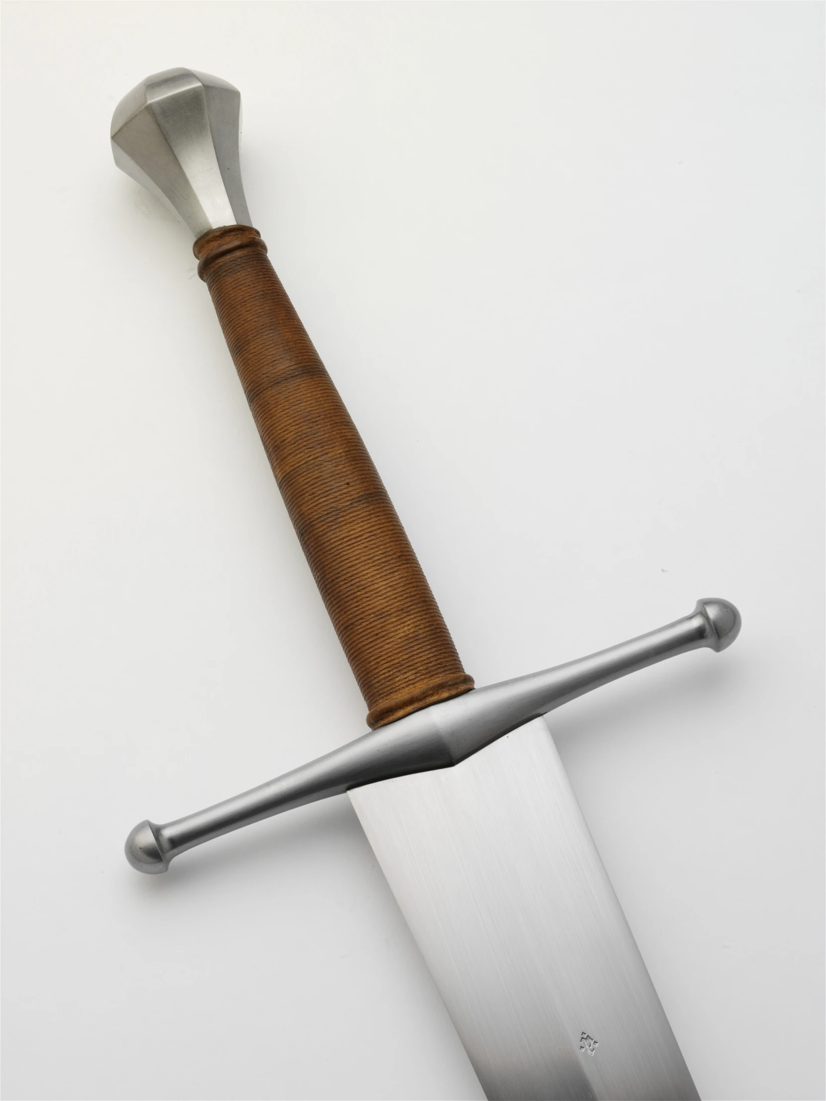 a large metal sword with a wood handle