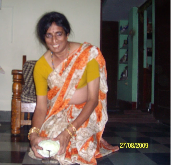 a woman sitting on the floor with a piece of food