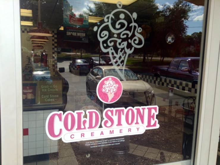 a store front with a sign for cold stone creamery