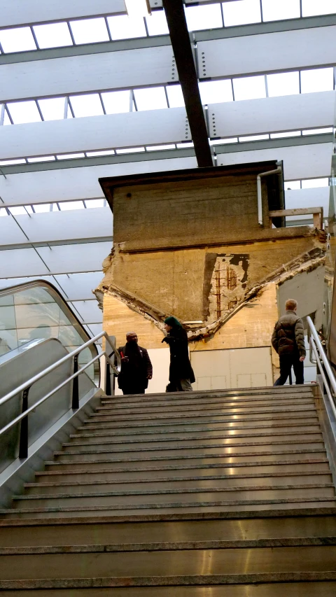 two men climbing up a flight of stairs