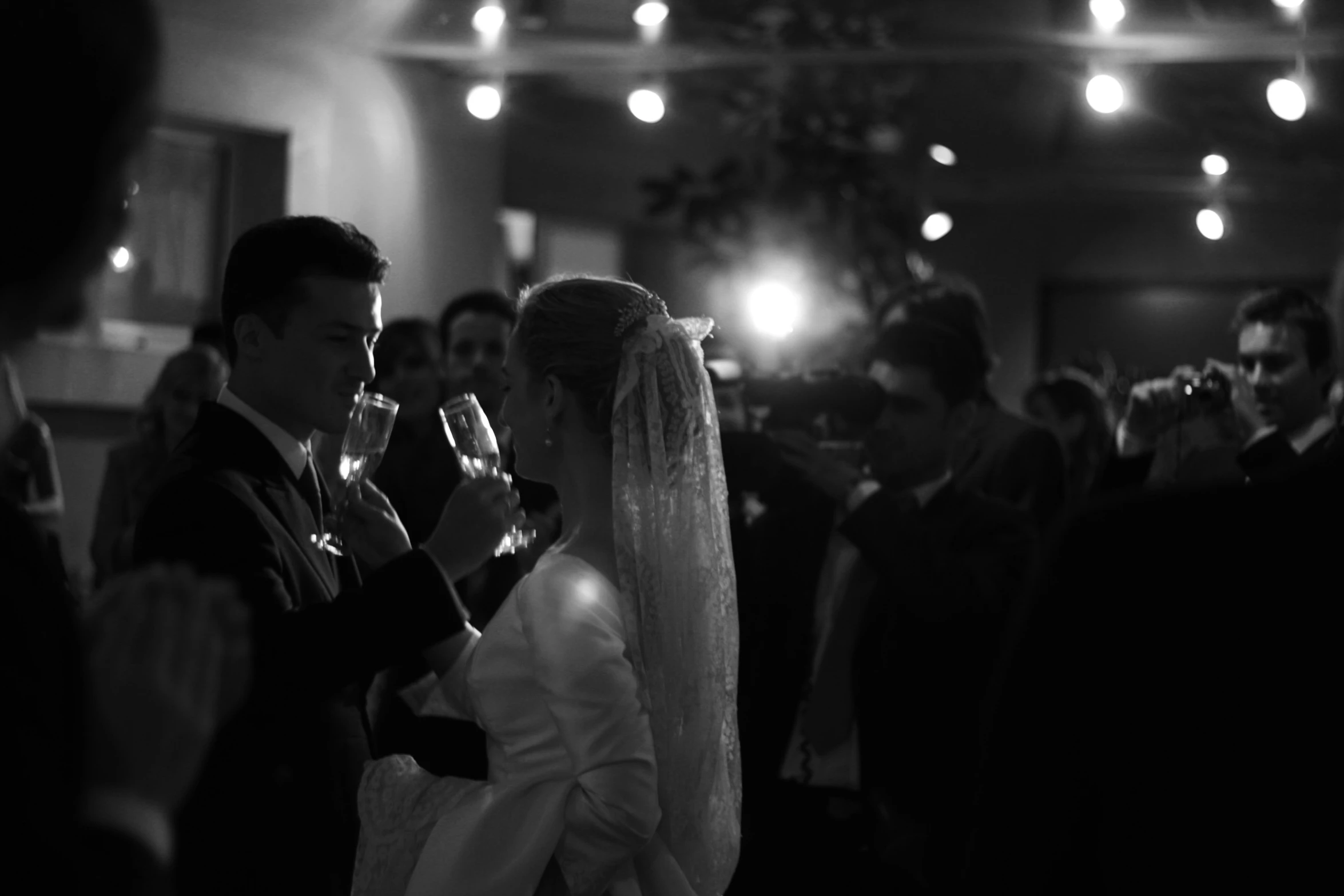 a man and woman with champagne at their wedding