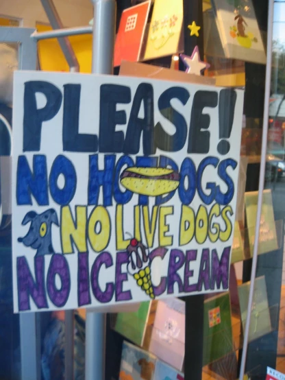 a sign on display at a store in an enclosed area