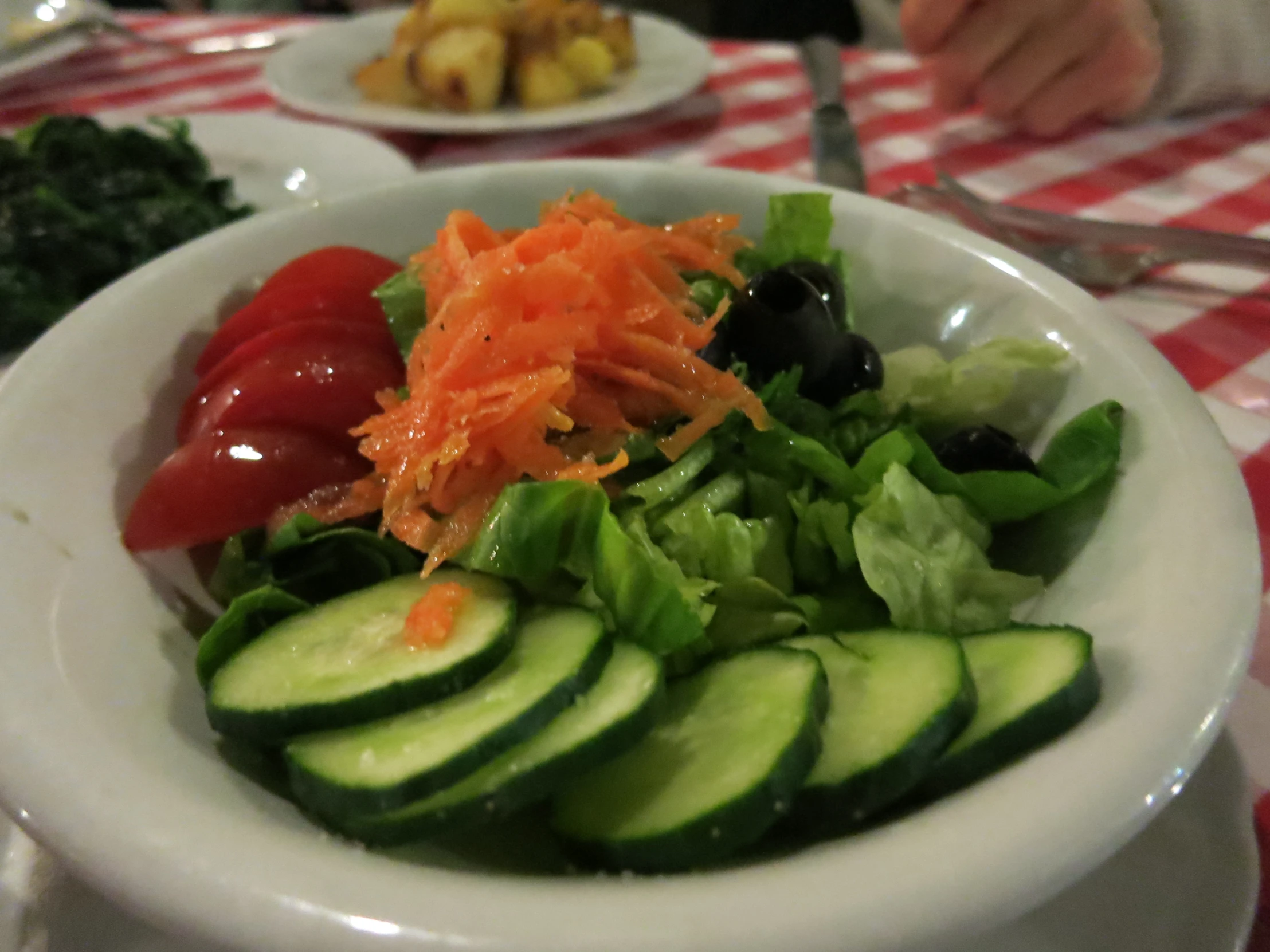 two bowls of vegetables on a table