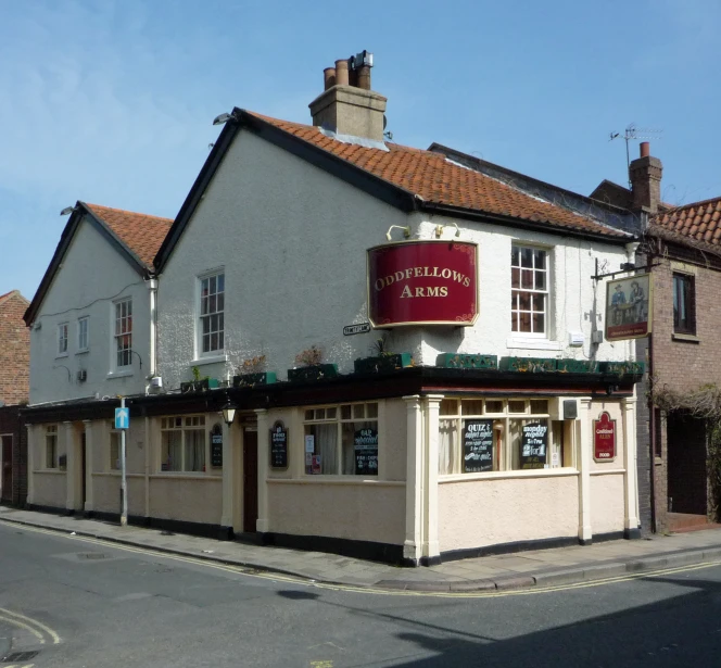 a restaurant called malsleys well ale on a city street