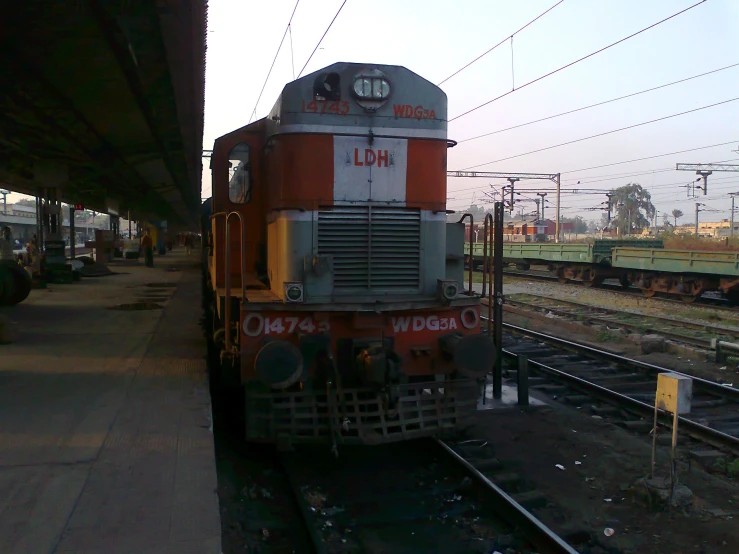 a freight train at the train station in rural countryside