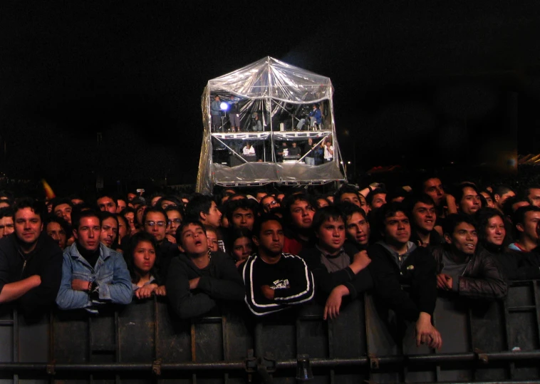 a man at a concert with many people