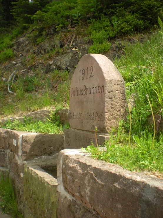 a stone monument near the top of a cliff