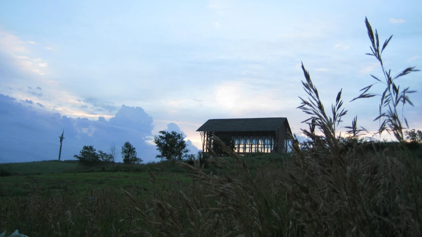 a small cabin sitting in the middle of nowhere