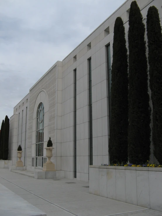 an architectural view of a building with a long hallway