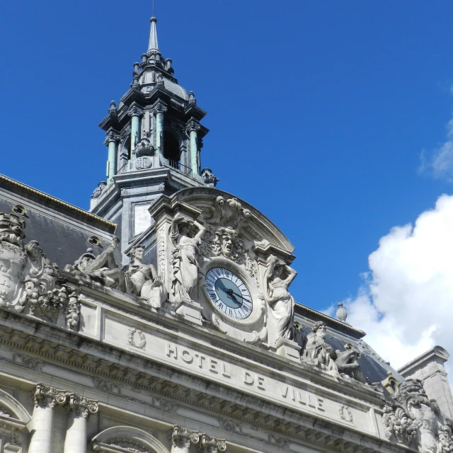 the clock tower is near the front entrance to an old building