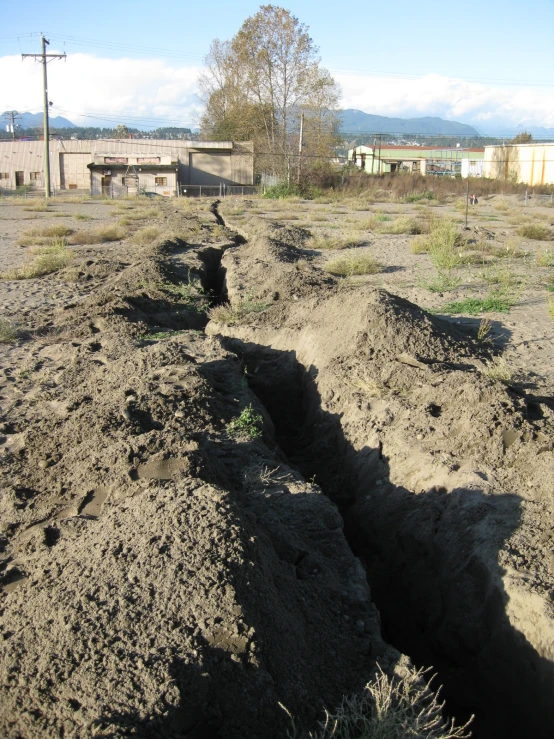 several different trenching is being dug in the dirt