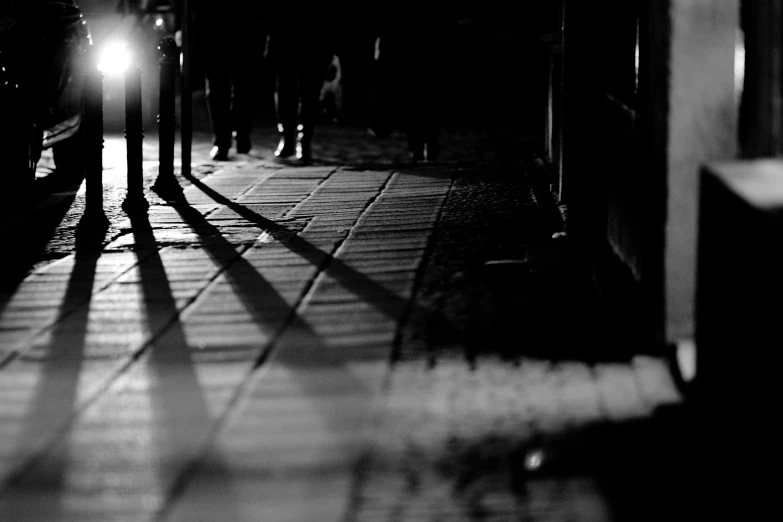 a person walking down a street in the dark
