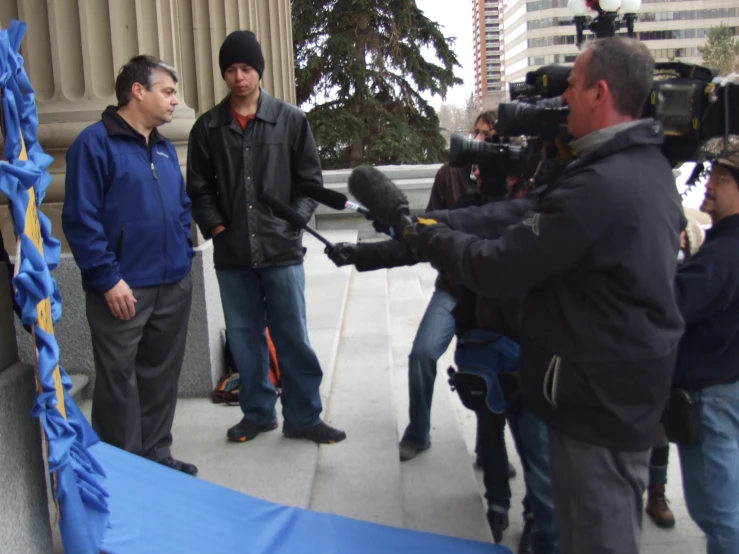 a cameraman recording a group of people