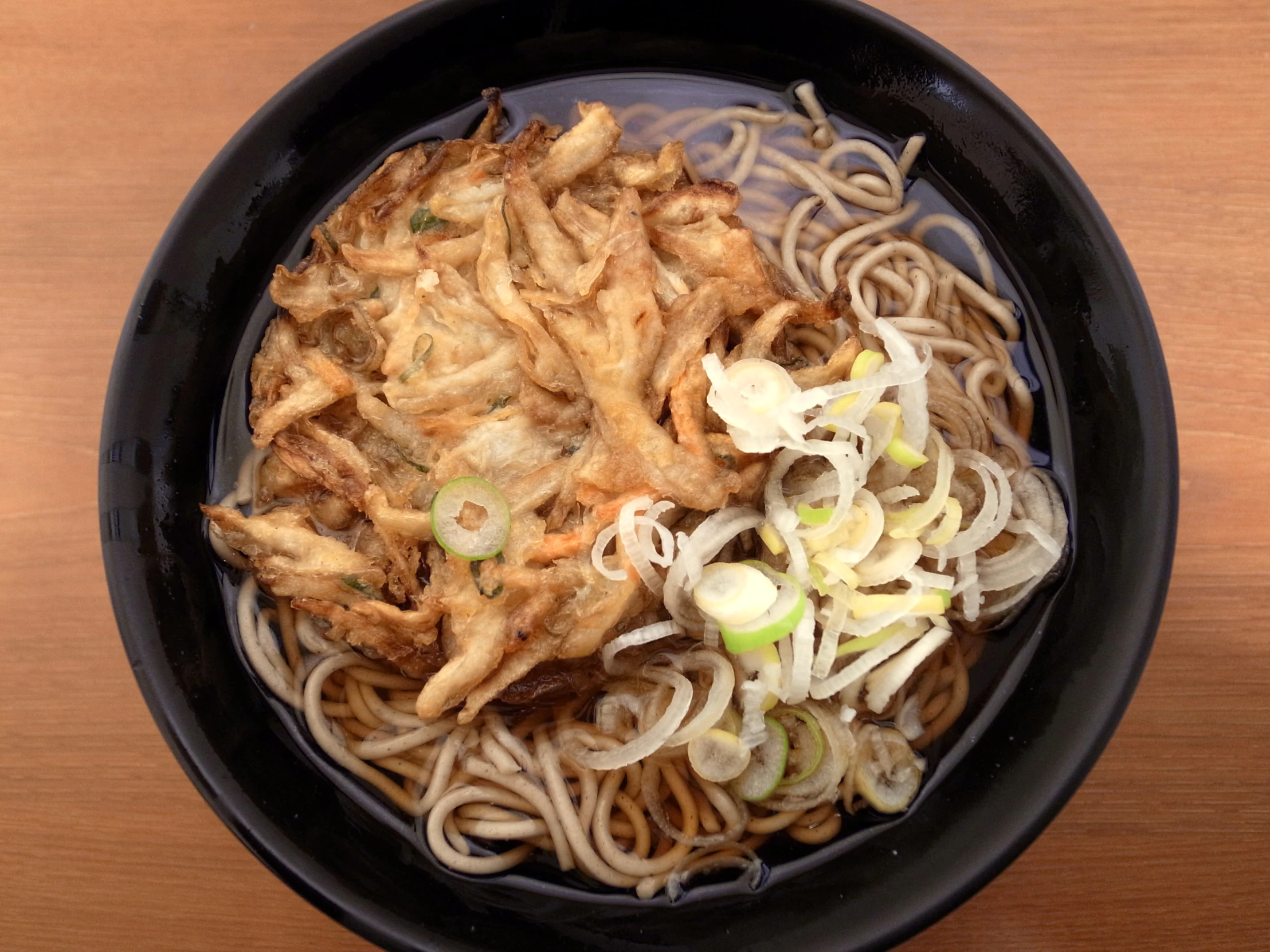 this bowl has some noodles and other foods in it