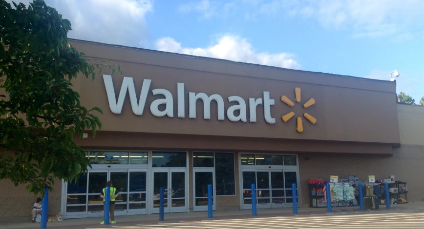 the front of a storefront that is brown with a sign walmart on it