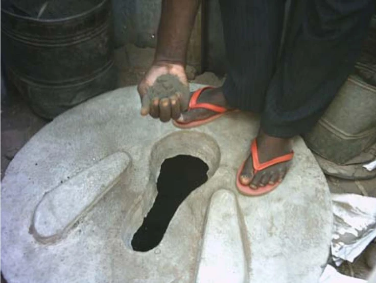 a man that is kneeling down on a piece of stone