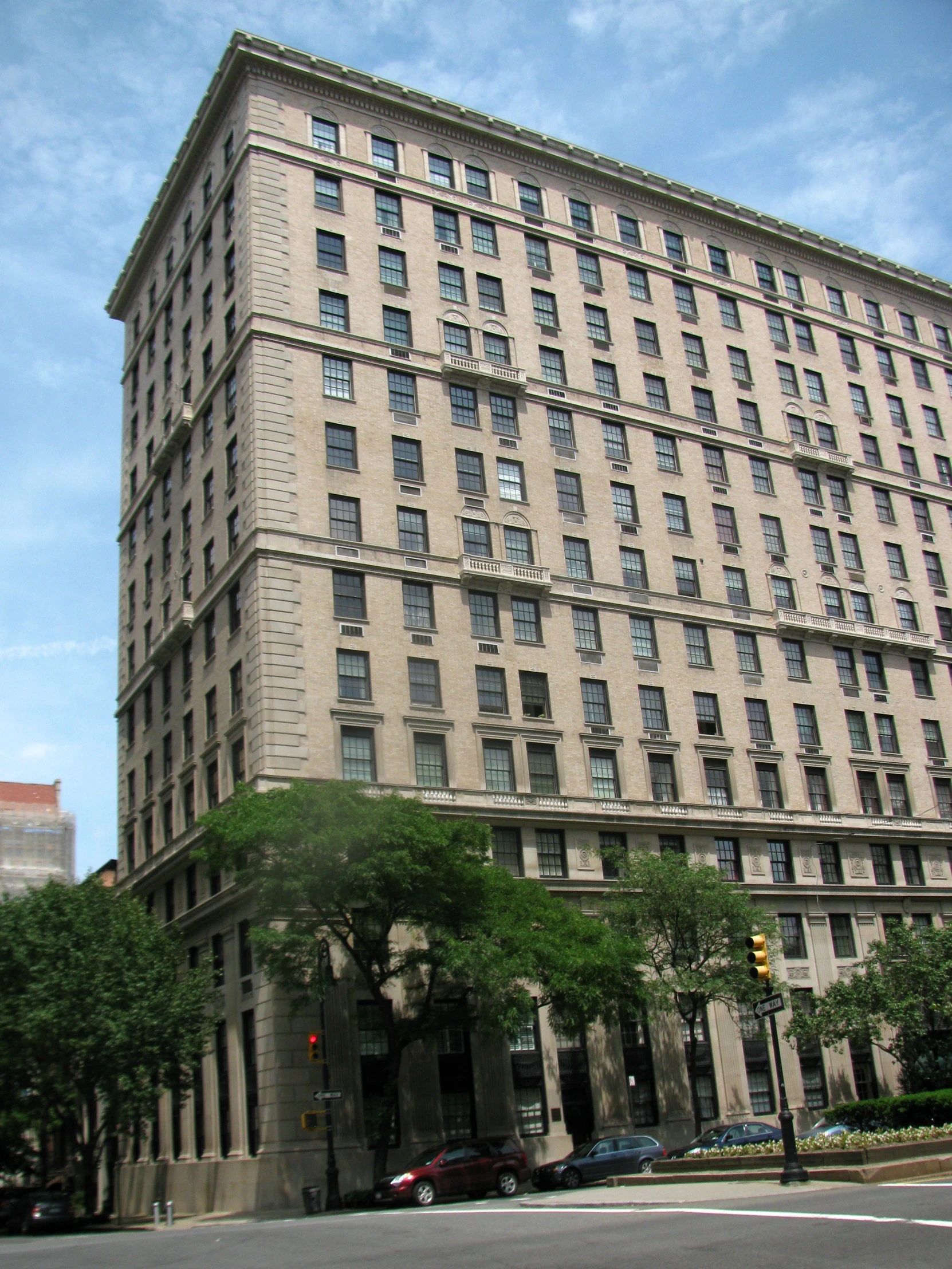 a large building in the middle of the street with many windows