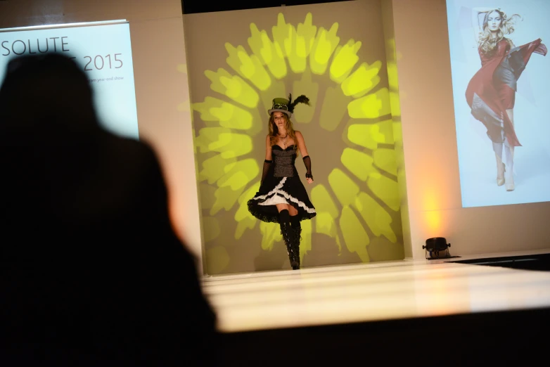 a woman on the runway in a skirt