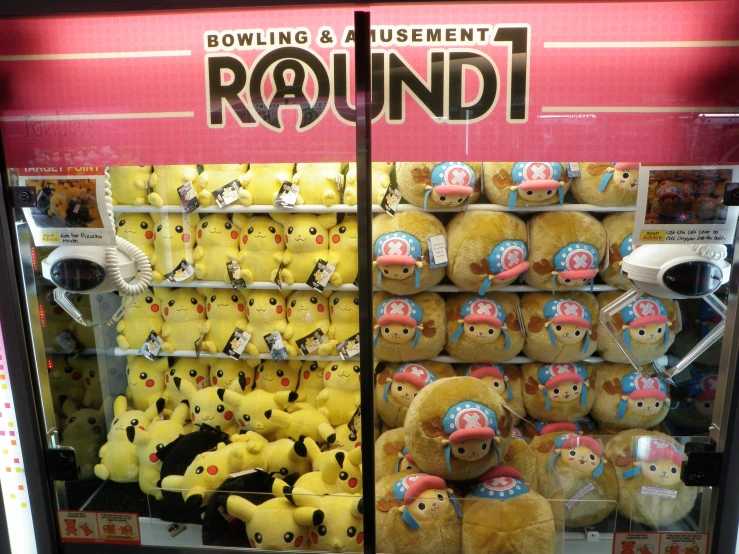 a store display with many pokemon stuffed animals