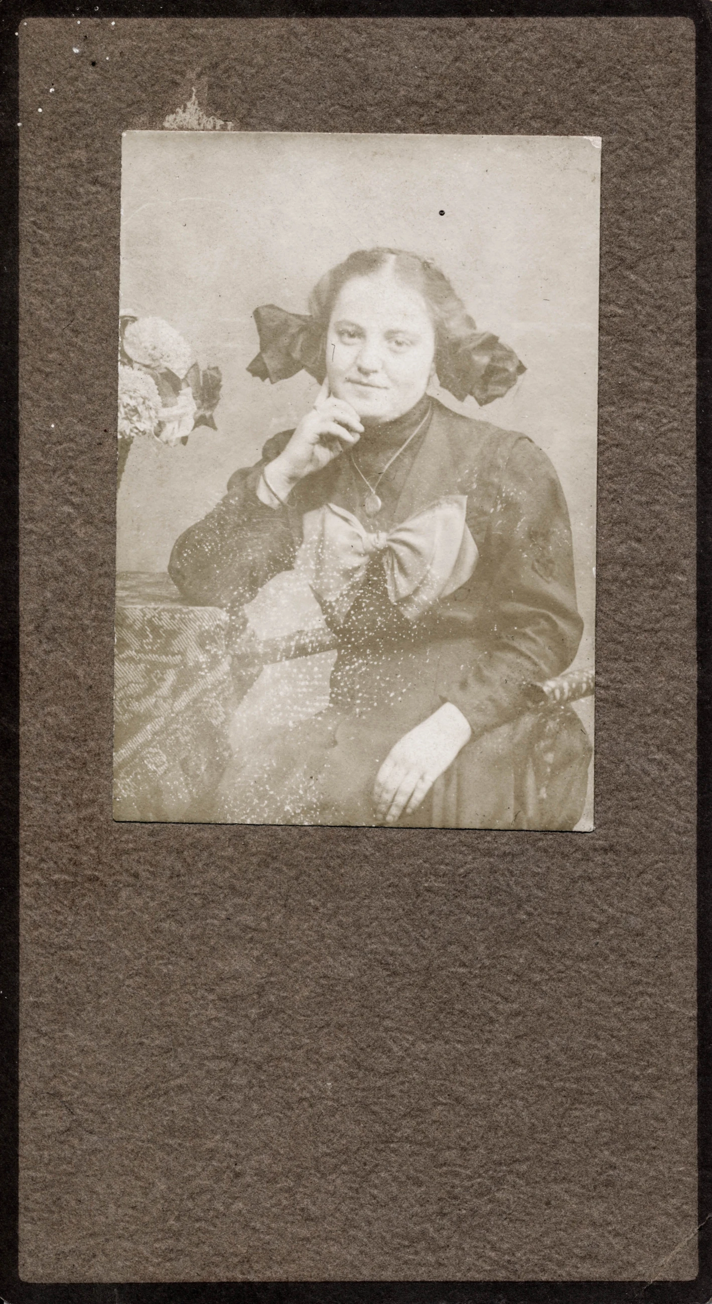 this sepia portrait is of a woman with long hair