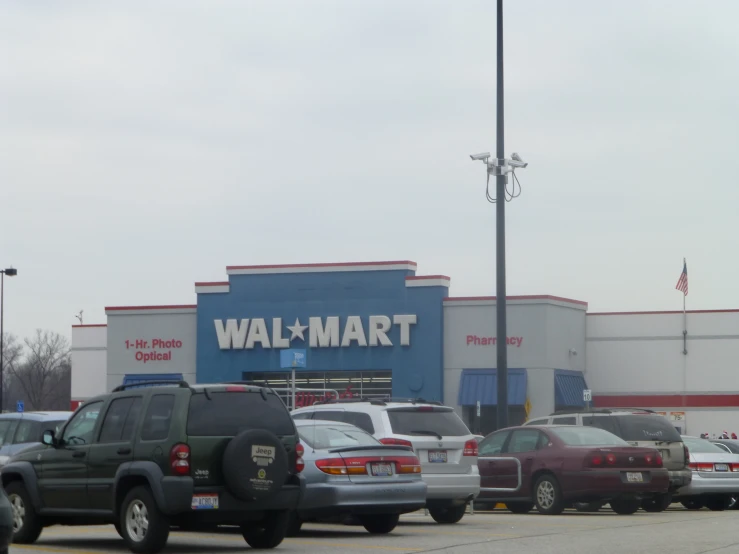 a walmart parking lot filled with lots of vehicles