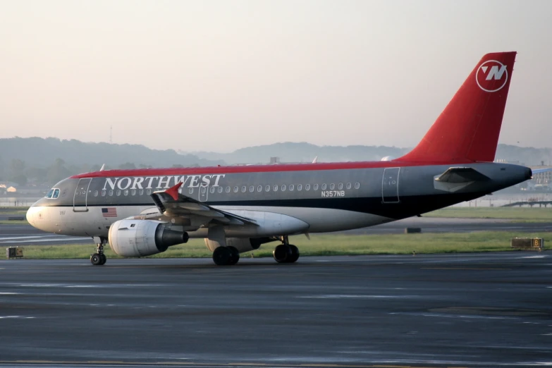 a plane is parked on the runway for people to board