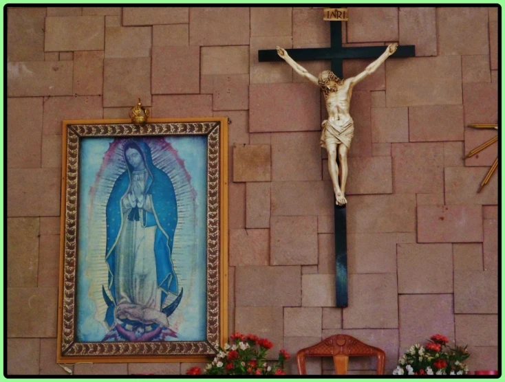 an crucifix in front of a brick wall