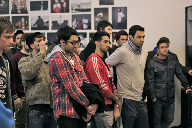 a group of young men in line standing near each other