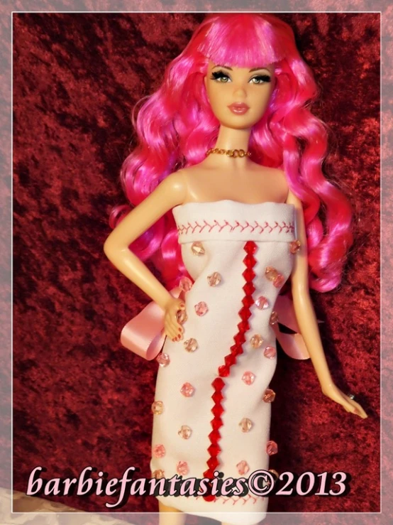 a barbie doll with pink hair in a dress