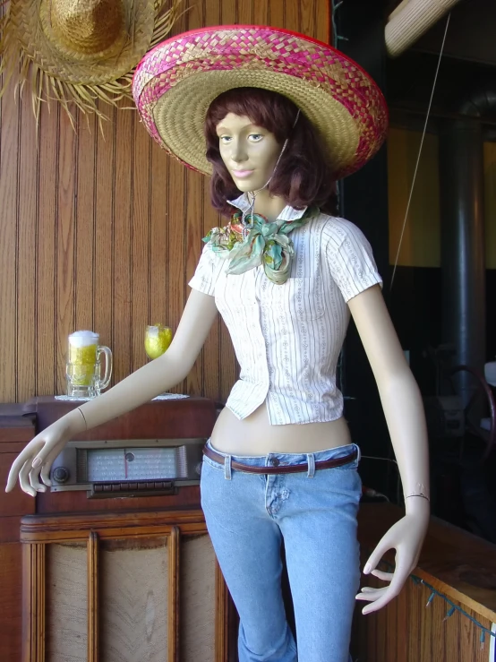 a woman wearing a big hat with a shirt on