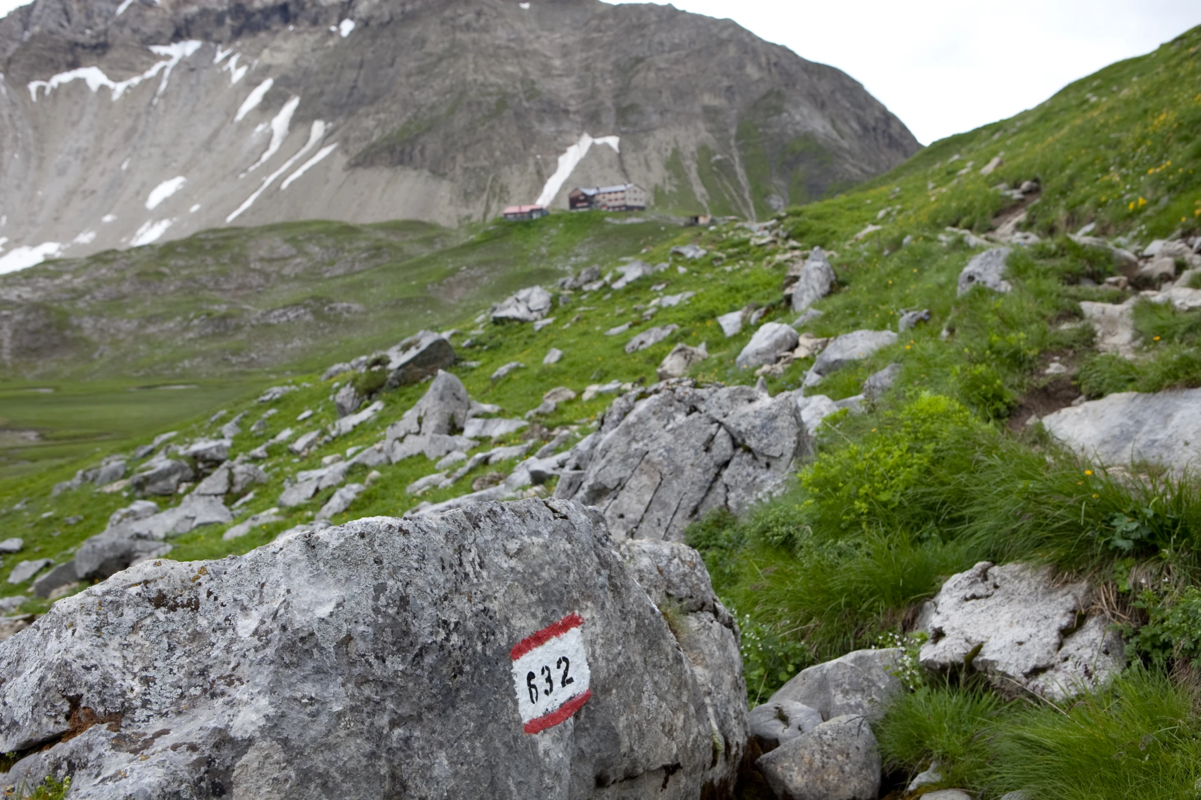 there is a rock that has been placed on a hill