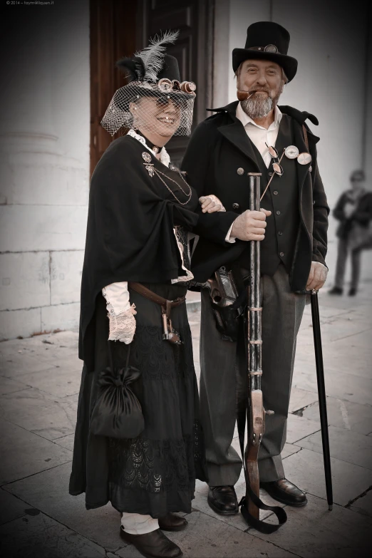 a man with a cane and a woman dressed as old fashioned witches