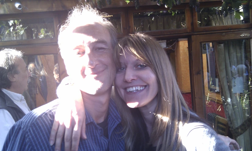 a man and woman posing for the camera together