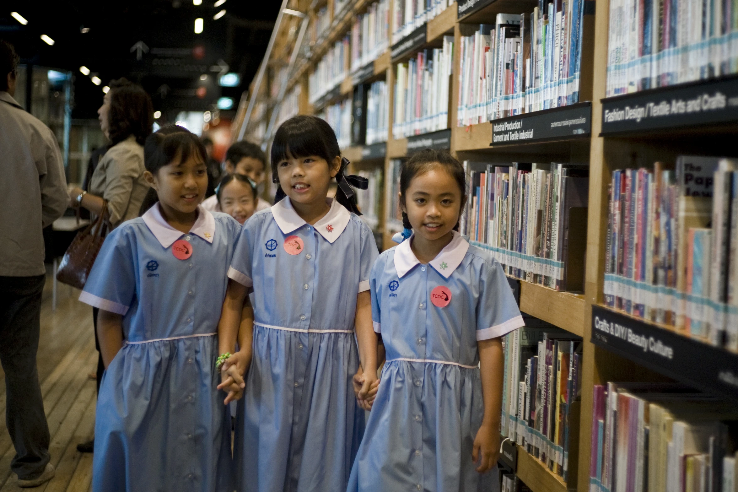 a group of little girls standing in a line