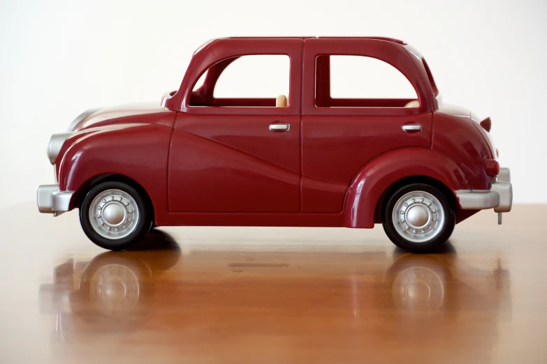 a toy car sitting on top of a table