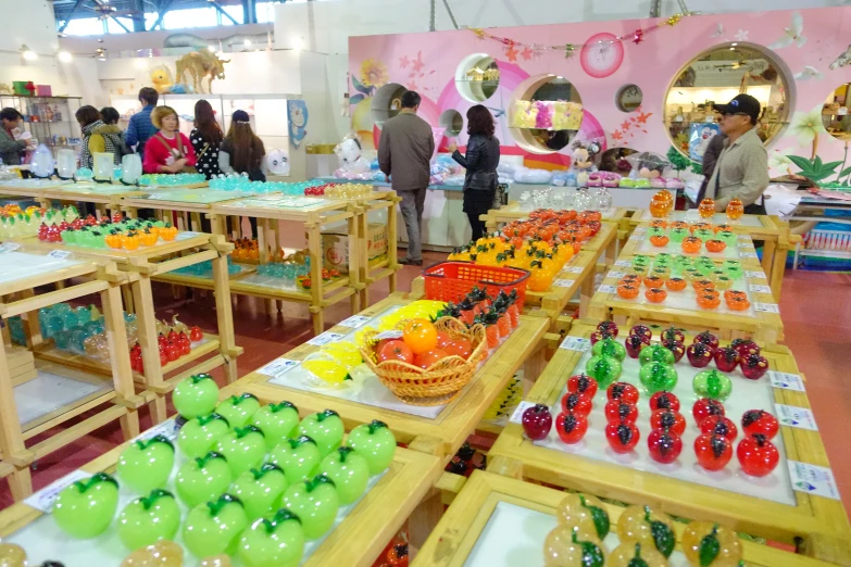 several tables filled with many different colored vegetables