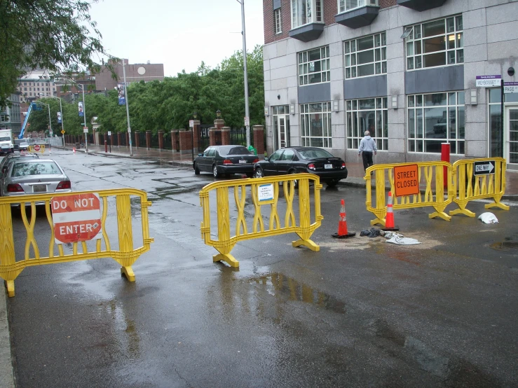 a city street is blocked off with barriers