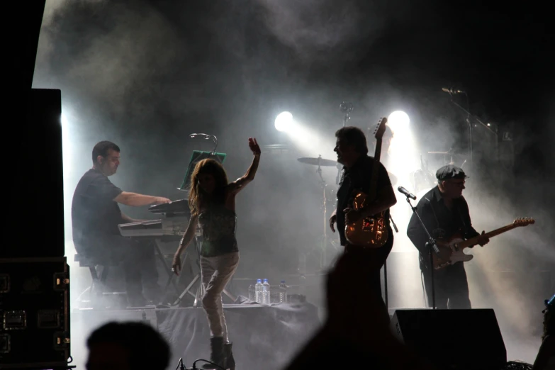 a group of musicians performing in front of a crowd